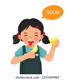 cute little girl holding lemon showing sour taste of tongue five senses