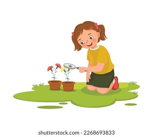 Cute little girl holding magnifying glass looking at ladybug on the plant flower