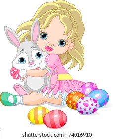 Cute little girl hugging Easter bunny