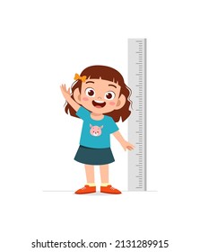 cute little girl measure height for grow progress