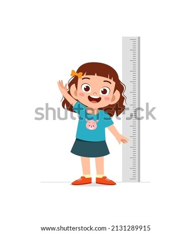 cute little girl measure height for grow progress