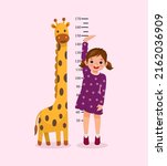 Cute Little girl measuring height of her growth on the background of wall with giraffe