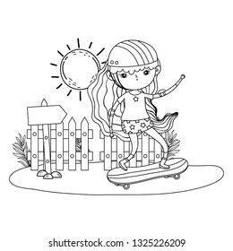 cute little girl mounted in skateboard in landscape