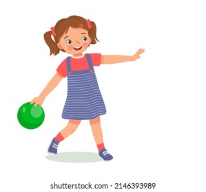 cute little girl playing bowling in the sport club ready to throw the ball