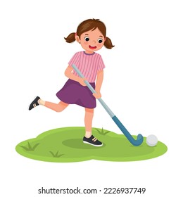 Cute little girl playing field hockey