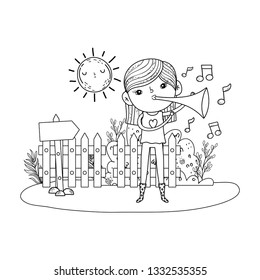cute little girl playing trumpet in the landscape