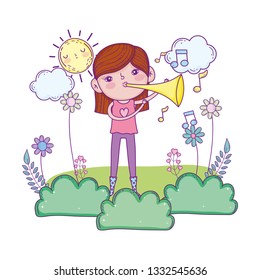 cute little girl playing trumpet in the landscape