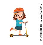 cute little girl riding scooter and wear helmet