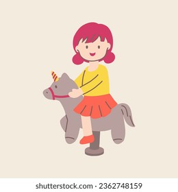 Cute little girl riding toy horse