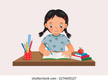 Cute little girl sitting on the desk studying writing on notebook doing her homework at home - Shutterstock ID 2174435127