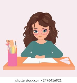 Cute little girl sitting on the desk studying writing on notebook doing her homework at home