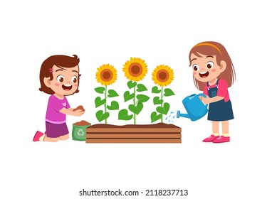 cute little girl stand and watering sun flower