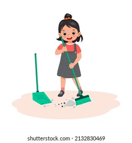 cute little girl sweeping the floor with broom and scoop at living room doing daily routine housework chores