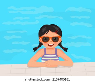 cute little girl in swimsuit and sunglasses having fun on swimming pool in summertime