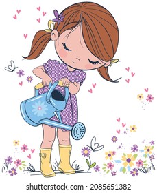 Cute little girl watering flowers in the garden