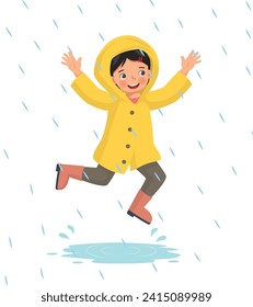 Cute little girl wears raincoat playing jumping  in the rain