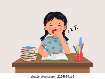 cute little girl yawning feeling sleepy while studying doing homework on the desk
