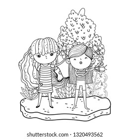 cute little girls playing maracas in the landscape
