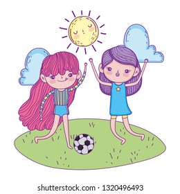 cute little girls playing soccer in the landscape