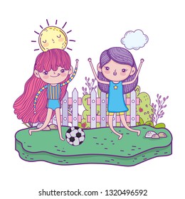 cute little girls playing soccer in the landscape