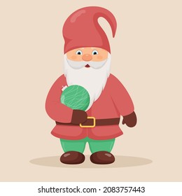 Cute little gnome with a christmas ball in his hands. Christmas and New Year character.