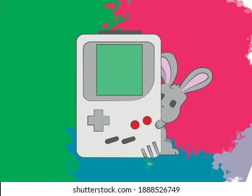 A cute little gray rabbit peeks out from behind an old game console. The Gameboy is from the past and was very popular. the rabbit hugs the console and holds it tight with his paws.