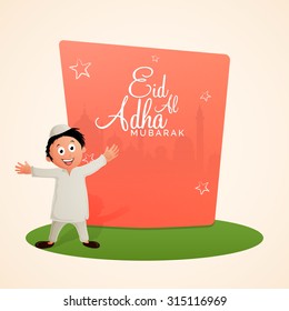 Cute little Islamic boy celebrating and enjoying on occasion of Muslim Community Festival of Sacrifice, Eid-Al-Adha Mubarak.