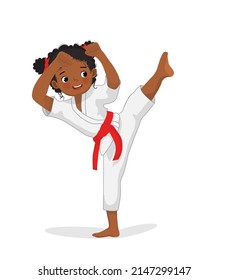 cute little karate kid African girl with black belt showing kicking attack techniques poses in martial art training practice
