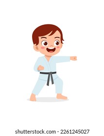 cute little kid training and showing karate pose