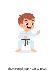 cute little kid training and showing karate pose