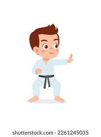 cute little kid training and showing karate pose