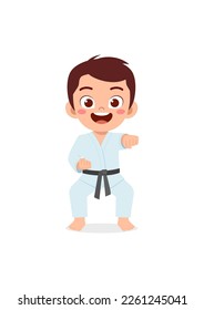 cute little kid training and showing karate pose