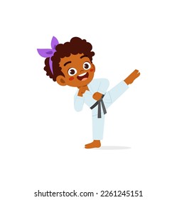 cute little kid training and showing karate pose