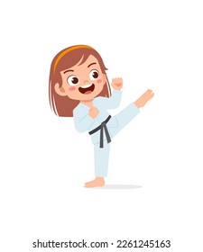 cute little kid training and showing karate pose