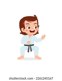 cute little kid training and showing karate pose