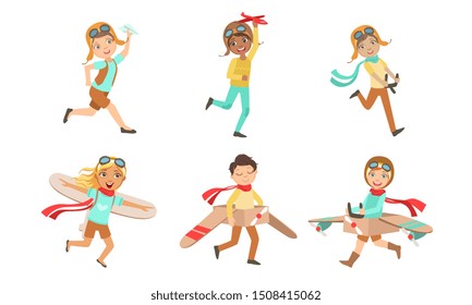 Cute Little Kids in Pilot Costumes and Retro Leather Helmets Playing with Toy Airplanes Set, Boys and Girls Dreaming of Becoming Pilots Vector Illustration