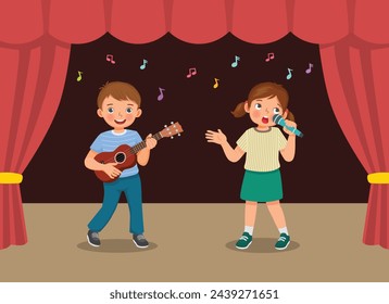 Cute little kids singing and playing guitar performing on the stage