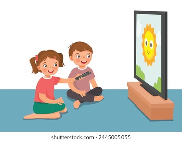 Cute little kids watching TV sitting on the floor together