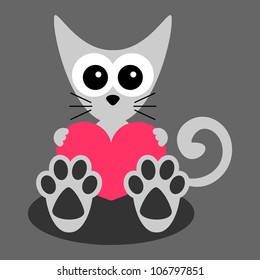 Cute little kitten holding a heart