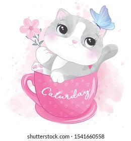 Cute little kitty inside the cup playing with butterfly