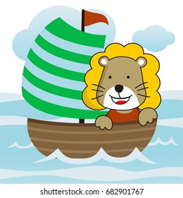 cute little lion spends his holiday as a sailor in the beach with sail boat