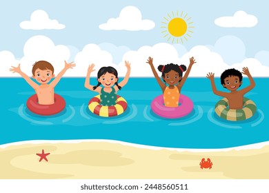 Cute little multi-ethnic kids with inflatable rings having fun in the sea at the beach