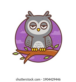 cute little owl in the tree branch