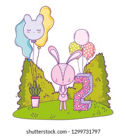 cute little rabbit with balloons helium in the landscape