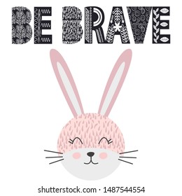 Cute little rabbit smiling face in scandinavian style. Inscription quote Be Brave in the Norman ethnic style. Graphic design.