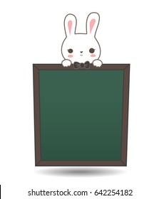 Cute little rabbits push their heads in front of the blackboard menu