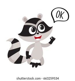 Cute little raccoon character sitting in lotus pose with OK word in speech bubble, cartoon vector illustration isolated on white background.