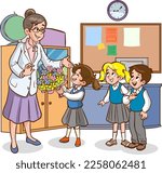 cute little schoolkids giving flowers to her teacher