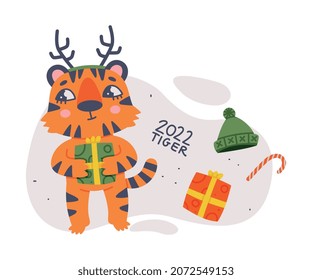 Cute Little Striped Tiger Cub with Orange Fur Holding Gift Box Enjoying Winter Holiday Vector Illustration
