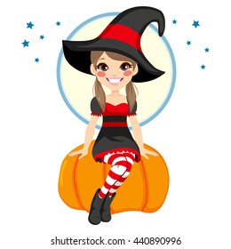 Cute little teenager witch girl sitting on big pumpkin